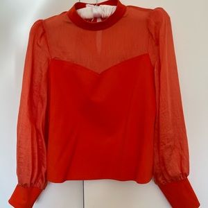 Bright orange blouse